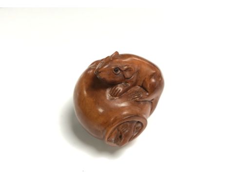 A carved Chinese hardwood netsuke - Two rats on a pot 