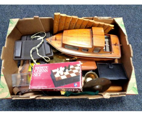 A box containing miscellaneous to include wooden boat, xylophone, brass ashtray and pipe stand, tobacco jar, chess set, hip f