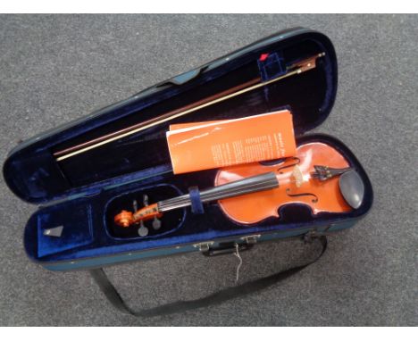 An Antoni violin and bow in case 