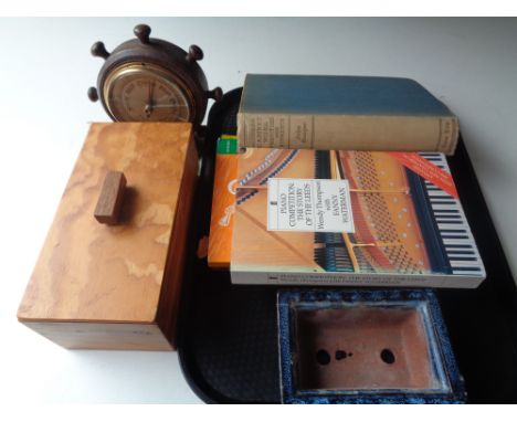 A tray containing music books, wooden trinket box, glazed pottery planter, together with a ship's wheel barometer   