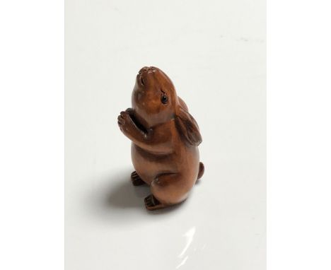 A carved Chinese hardwood netsuke - Rabbit 