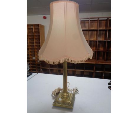 A brass Corinthian column table lamp with shade 