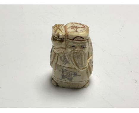 A carved Chinese bone netsuke - Village elder holding a staff