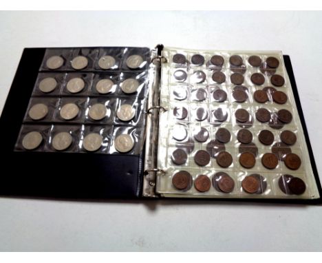 A coin collector's album containing pre decimal British coinage to include George V and Queen Elizabeth II  