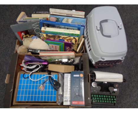 Two boxes containing vintage typewriter, books, door stops, fax rolls, electrical kit, a pet carrier