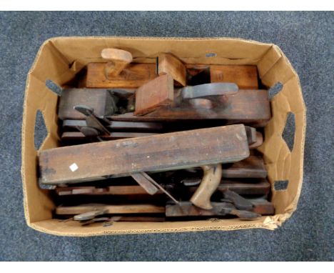 A box containing a large quantity of vintage woodwork planes
