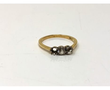 An 18ct gold ring set with two paste stones, one missing, size Q.  CONDITION REPORT: 2.5g