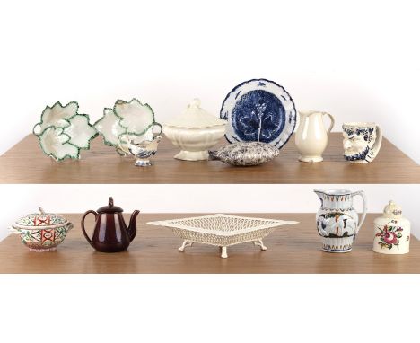Group of creamware and potteryEnglish, 19th Century, including a satyr mask stirrup cup, a blue and white pottery plate paint