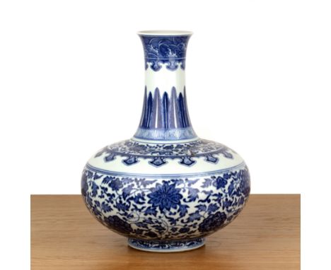 Blue and white porcelain vaseChinese, 20th Centurywith trailing fruit, palmettes, ruyi border, and Qianlong zhuanshu mark, 35