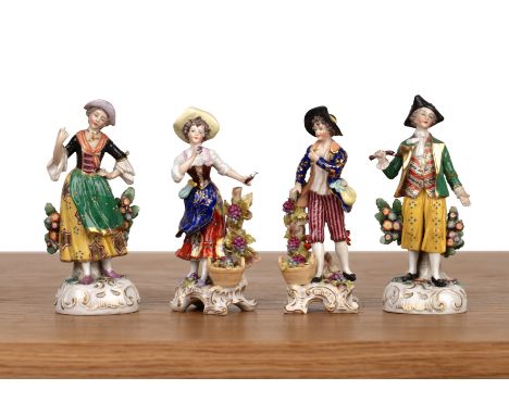 Two porcelain pairs of figuresincluding a pair of country figures, marked with a Sitzendorf mark,  With minimal wear and loss