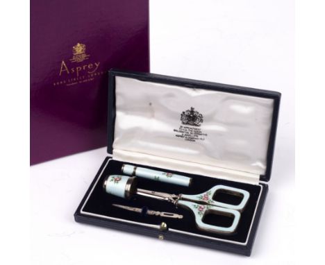 Asprey of London silver and enamel sewing set, in fitted case, the scissors, thimble and needlecase with floral decoration on
