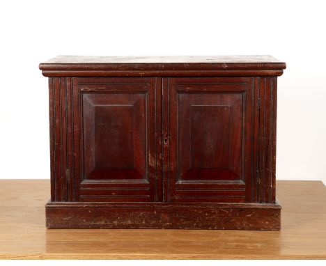 Numismatist interest Mahogany cased coin cabinet, two fielded panel doors enclosing numerous shallow shelves with turned hand