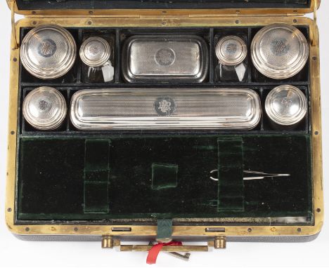 Vanity or dressing case French, 19th Century, leather bound, fitted interior, with white metal (indistinct marks) and glass d