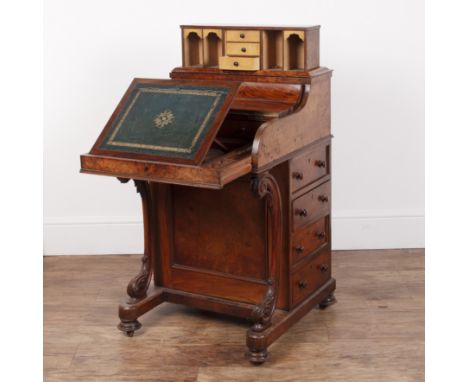 Burr walnut davenportVictorian, with lift-up shaped top concealing a fitted interior, above four side fitted drawers, and fou