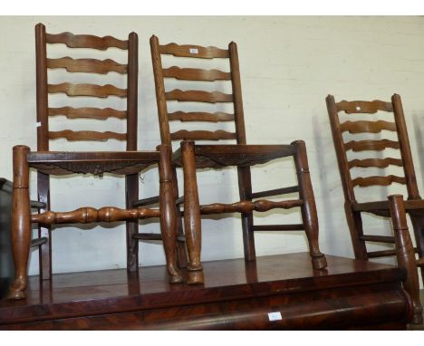 A 19th century set of 4 country made elm rush seat ladder back chairs