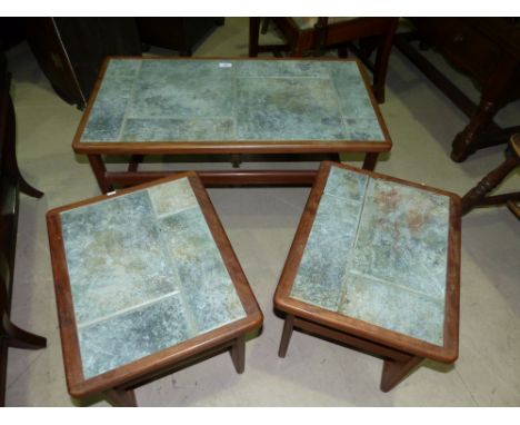 A 1960's nest of 3 teak tile top tables