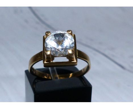 A 9 carat hallmarked gold ring set with a diamond simulant, 3.2 gm