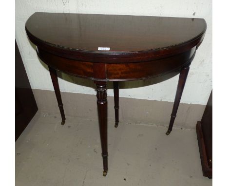 A mahogany period style demi-lune fold-over card table