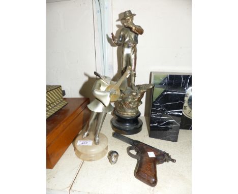 An Art Deco silvered metal figure of Pierrot with lute (head loose); a silvered metal figure of a cowboy (a.f.); an early Dia