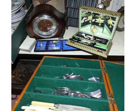 A boxed manicure set; a cutlery canteen and cutlery; a striking mantel clock; a set of miniature Shakespeare on original book