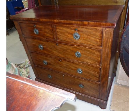 An early 19th century mahogany chest of 3 long and 2 short drawers, with line inlay and brass ring handles