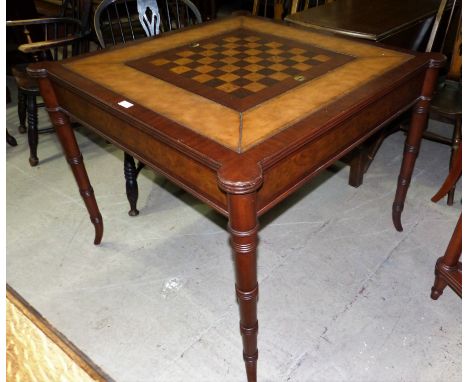 An Ethan Allen Georgian style games table with reversible square top inset revealing backgammon board, tooled letter surround