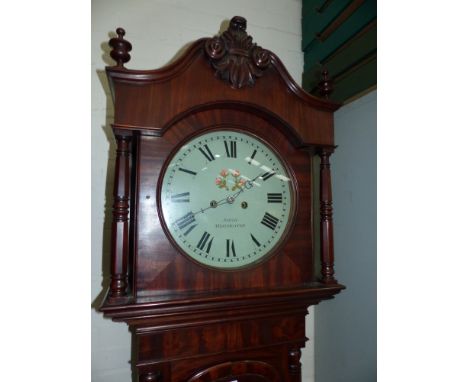 A 19th century mahogany longcase clock by Smith, Manchester, with carved crest and turned pillars to the hood, arched door an