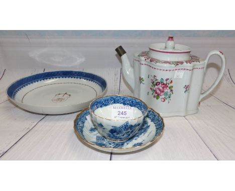 A First Period Worcester cup and saucer set decorated in blue and gilt; a similar early English teapot (some damage)