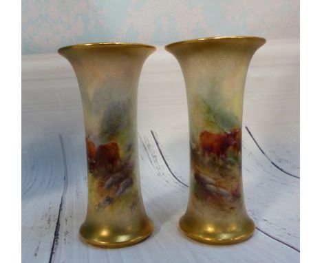 A pair of Royal Worcester waisted cylindrical vases decorated with highland cattle, signed H Stinton, 4½" (restoration to bas