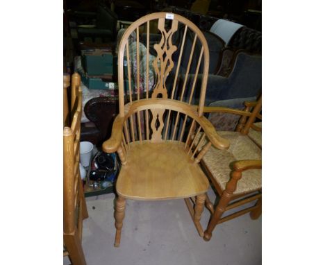 A country made light elm rocking chair with 'H' stretcher