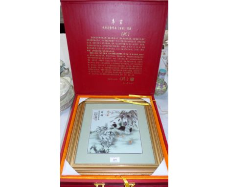 A Chinese painted ceramic tile picture depicting dogs, in display/carry case