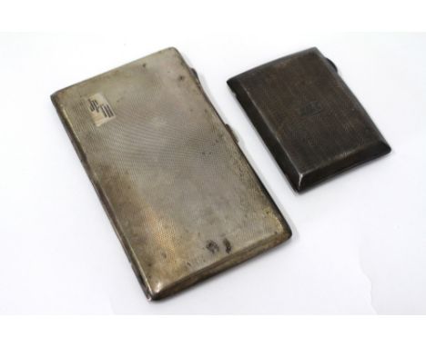 TWO BIRMINGHAM SILVER CIGARETTE CASES with engine turned decoration and each monogrammed (2)