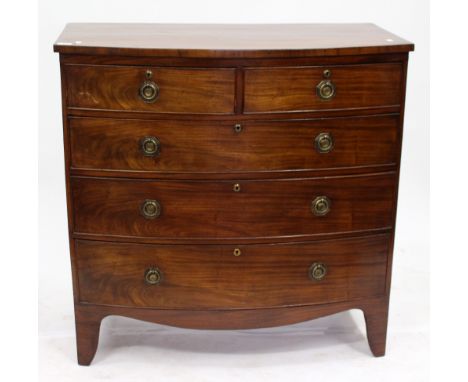 A VICTORIAN BOW FRONTED CHEST  of two short and three long drawers with brass ring handles raised on bracket feet, 104cm wide