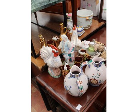 A GROUP OF VARIOUS CERAMICS to include two tin glazed pottery cockerels, a German gilt ruby glass liqueur set, table lamps, a