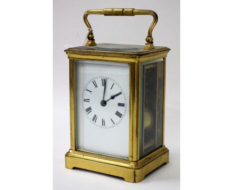 A FRENCH CARRIAGE CLOCK with white enamel Roman dial, silvered platform lever escapement, coiled gong strike and corniche cas