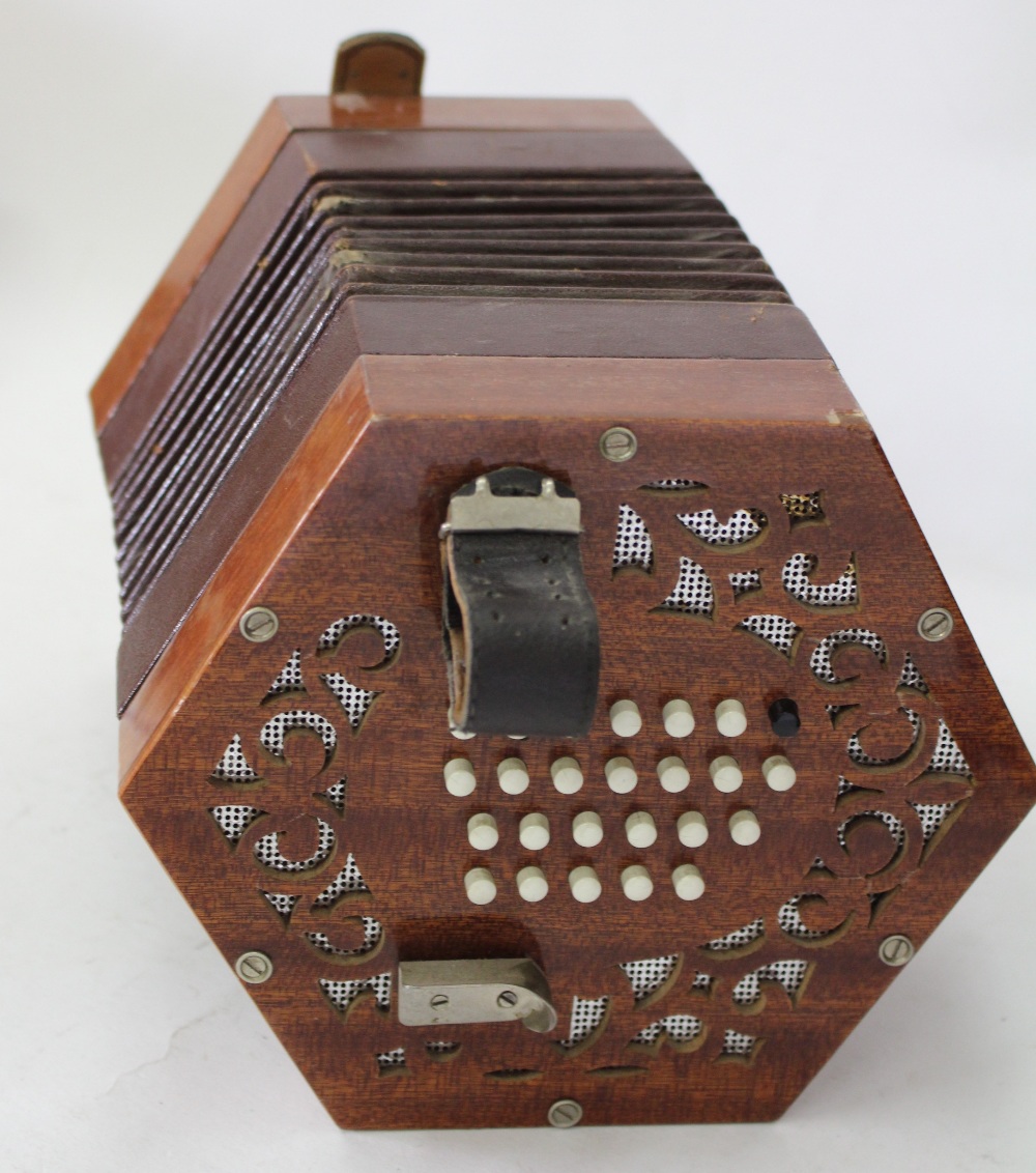 A MID TO LATE 20TH CENTURY ITALIAN MADE CONCERTINA with maroon leather