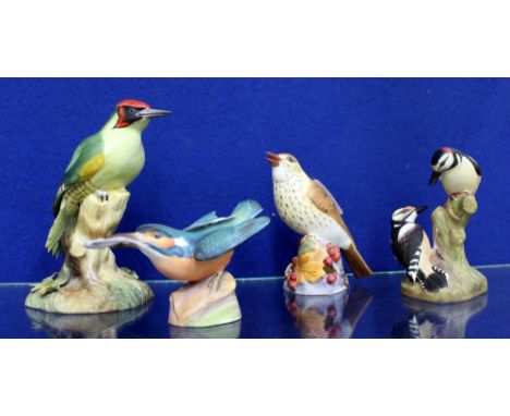 A ROYAL CROWN DERBY WOODPECKER FIGURE GROUP A Royal Worcester bone china thrush, Royal Worcester pied woodpeckers and a Kingf