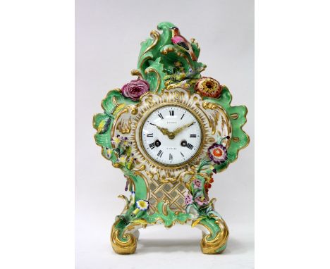 A COALPORT PORCELAIN MANTLE CLOCK c.1830 with polychrome decorated flower encrusted case, the Continental movement with an en
