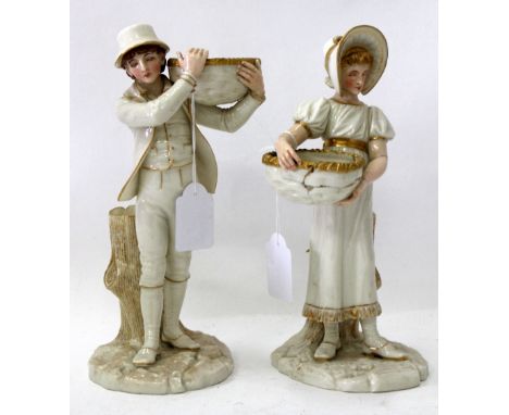 A PAIR OF 19TH CENTURY ROYAL WORCESTER HADLEY FIGURE GROUPS with blush ivory and gilt painted decoration of a boy and a girl 