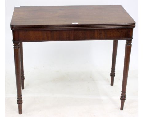 A LATE 18TH / EARLY 19TH CENTURY MAHOGANY FOLD OVER TOP CARD TABLE standing on tapered ring turned legs, 87cm x 75cm x 45cm