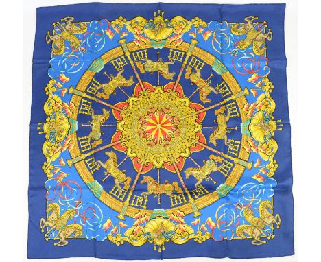 Hermes silk scarf "Luna Park" fairground design designed by J Metz in bright colours on kroyal blue background with unusual f