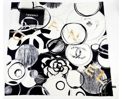 Chanel silk scarf in white, black and gold with typical motifs in abstract design, hand rolled hem with gift bag and ribbonCo
