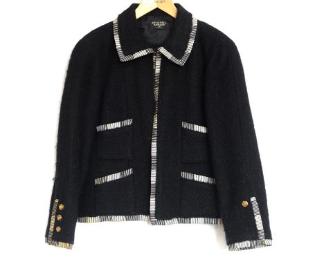 Chanel black jacket with silk black and white trimming, 4 pockets, silk lined, light padding to shoulders, in tweed mohair, g