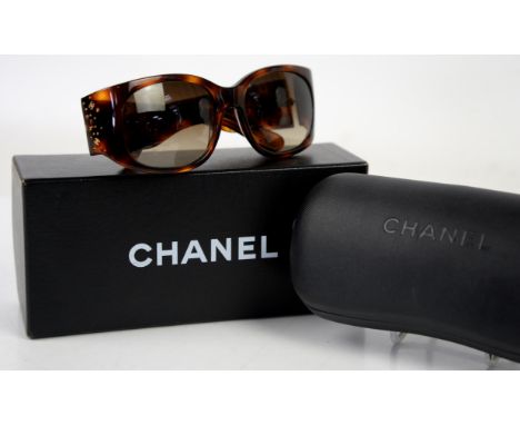Chanel sunglasses in faux tortoiseshell and diamanté with multiple crossed CCs together with box, hard case and silk cleaning