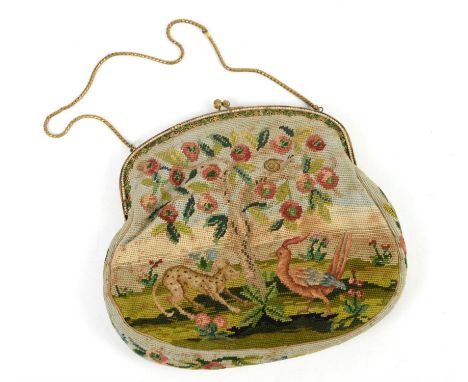 Highly decorative tapestry evening bag on gilt metal frame, embellished with tiny pearlbeads and enamelled fleurs de lys, wit