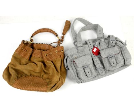 Anya Hindmarch black leather handbag with snake skin effect , outer pocket with stainless steel clasp  and interior pockets, 