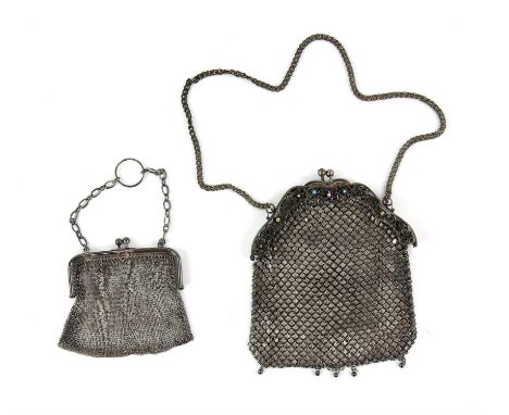 A silver mesh purse and another in plate with paste stones and enamel stones