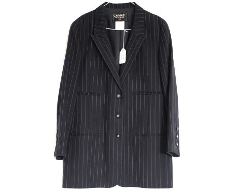 Fine wool navy blue pinstriped Chanel blazer with 4 pockets and typical crossed Cs buttons on cuffs and front, marked 1996, S