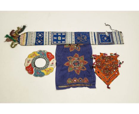 A collection of Tibetan embroidered panels, some with mirror discs; a good long panel of Chinese embroidered fabric, and a be