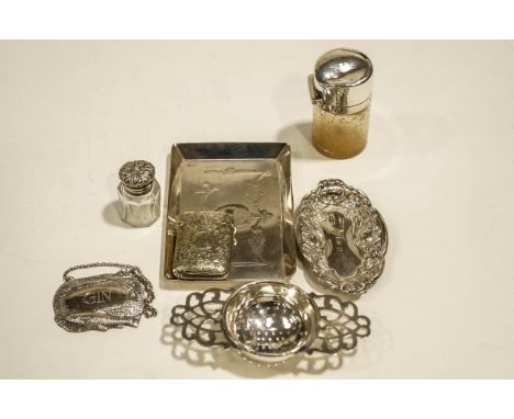 A silver pin tray, by Goldsmiths and Silversmiths Co Ltd, London 1910, decorated with swags and garlands, 11.6 cm long; a sma